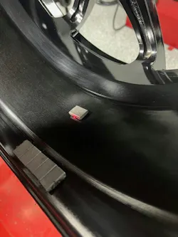 A small amount of weight is needed to achieve optimal balance. Here, the tape weight is placed at the center mass of the assembly. A small amount of weight is needed to achieve optimal balance. Here, the tape weight is placed at the center mass of the assembly.