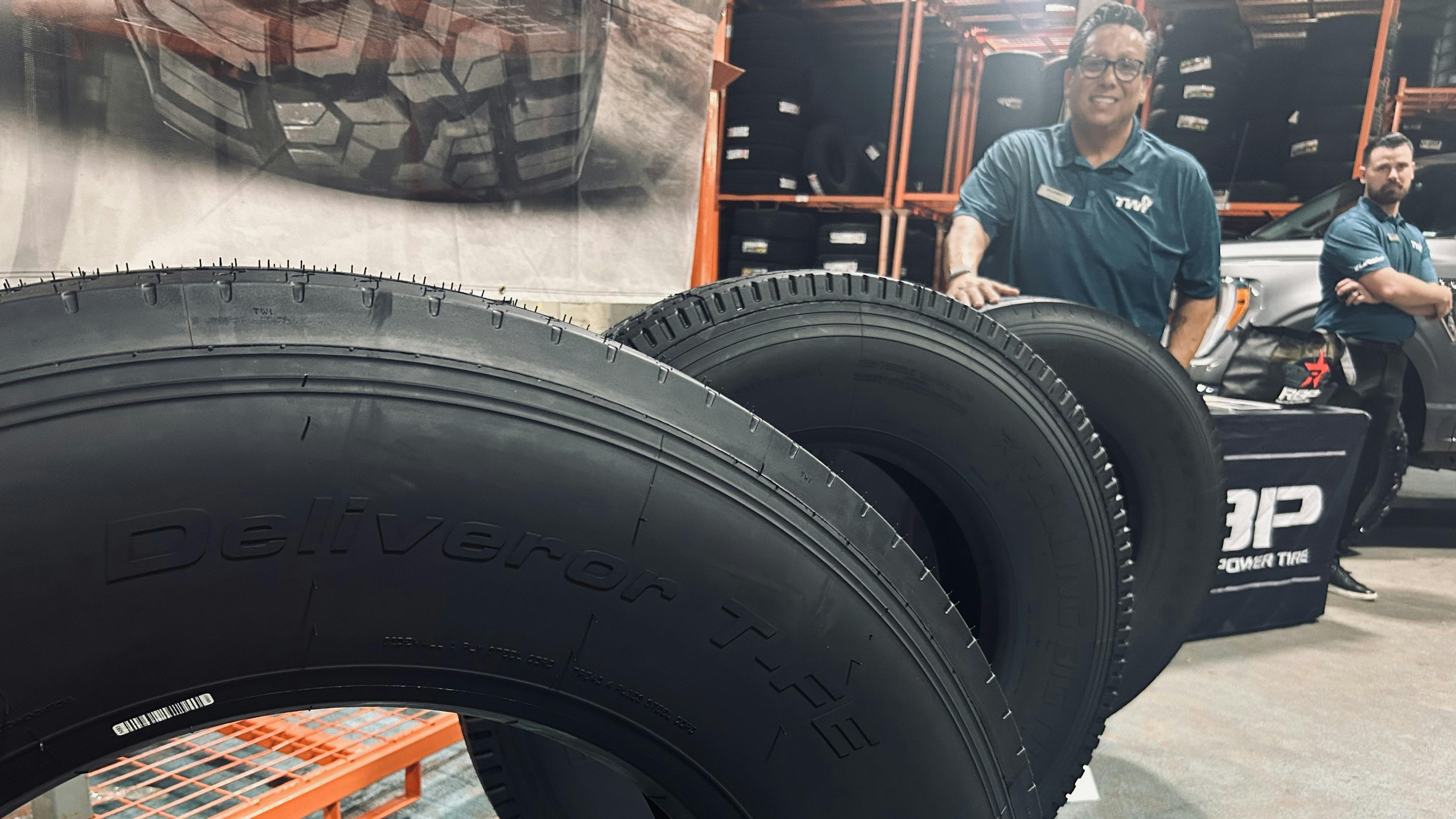 Turbo Wholesale Tires LLC displayed several of its new Rolling Big Power TBR tires during a recent open house event at the company&rsquo;s Hammond, Ind., distribution center. (Pictured behind tire, JD Casas, Turbo's national sales manager, commercial.)