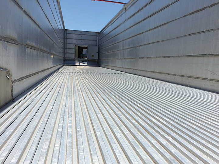 An interior view shows a Hallco trailer floor.