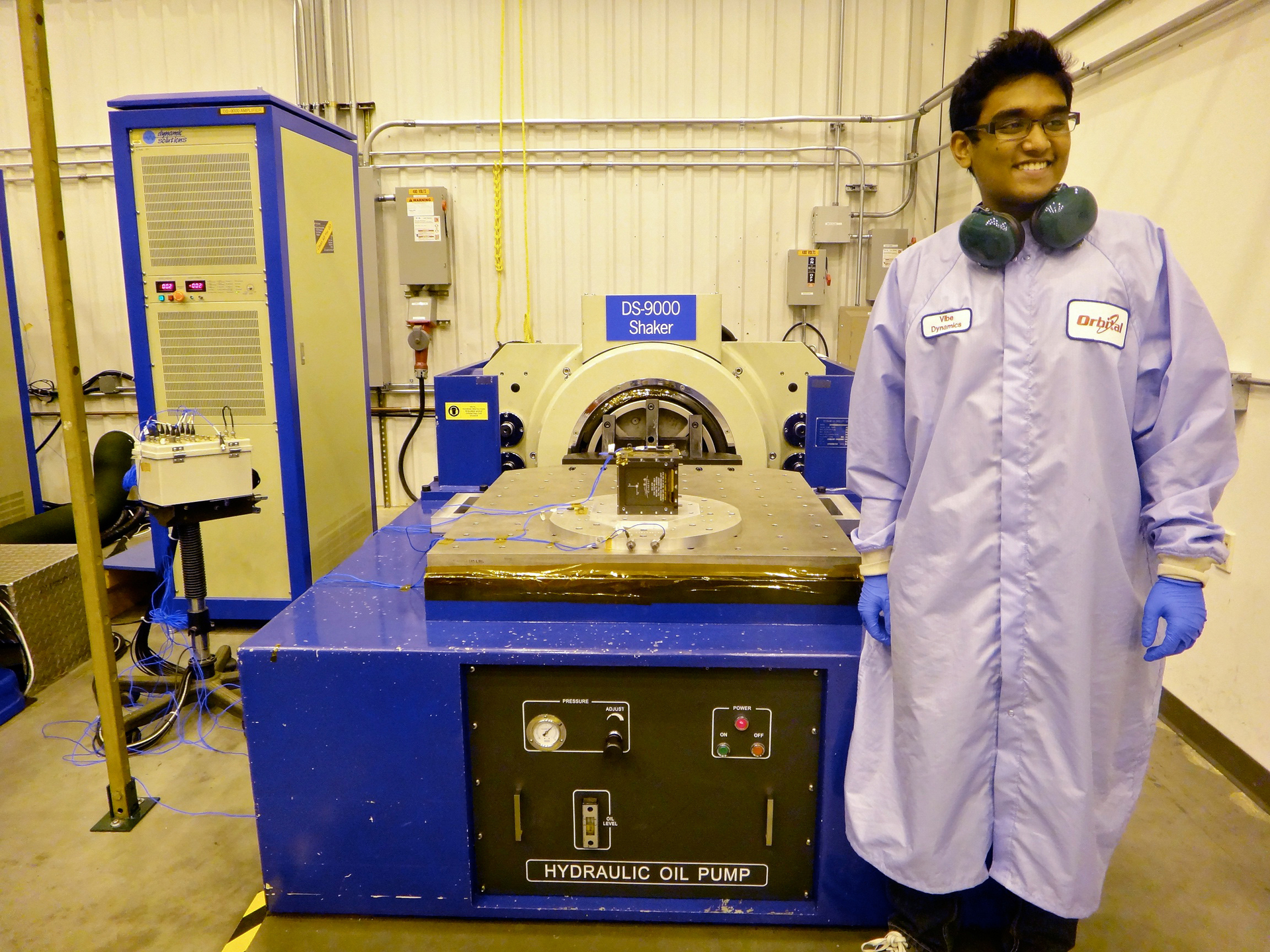Rohan Punnoose next to TJ3Sat the first CubeSat to be built by high school students and launched into space through NASA39s ELaNA program Photo courtesy of Thomas Jefferson High School