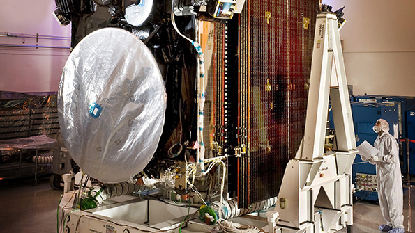 A Lockheed Martin technician inspects part of an AEHF satellite as it prepares to enter active service in support of United States military forces Image courtesy of Lockheed Martin