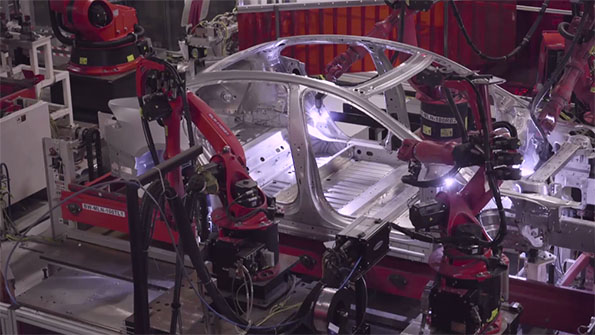 Robots assembling Tesla car