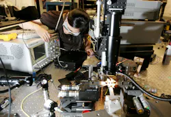 Woman-Testing-Electronics Woman-Testing-Electronics