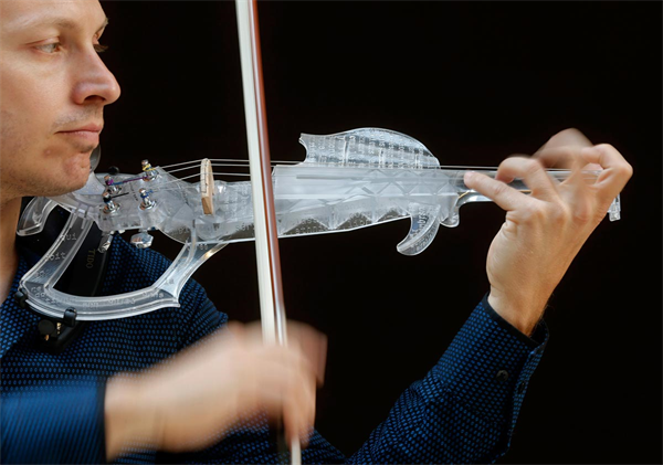 Man playing 3D printed violin