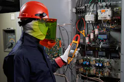 Worker Measuring Electronics Worker Measuring Electronics