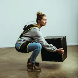 HeroWear worker demonstrating exosuit HeroWear worker demonstrating exosuit