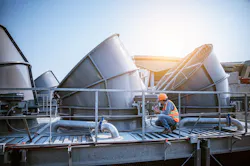 engineer checking cooling tower engineer checking cooling tower