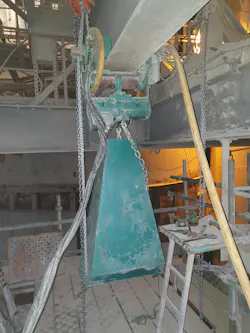 A 6,600-pound air-powered chain hoist mounted in a motor trolley was used to raise the new hoist to the required 196-foot height. A 6,600-pound air-powered chain hoist mounted in a motor trolley was used to raise the new hoist to the required 196-foot height.