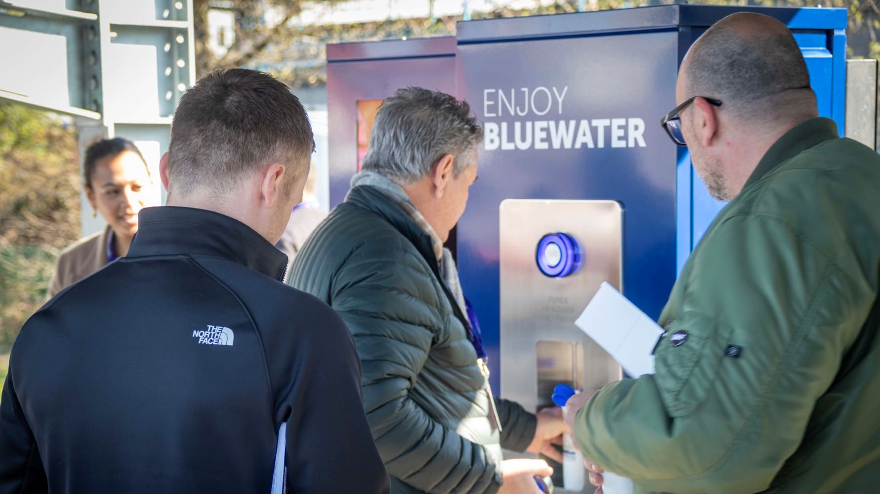 Rush to fill sustainable water bottles with Bluewater at 21st century EV recharging hub where single-use plastic bottles of water are made a thing of the past.