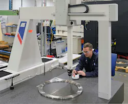 Close-up view of Dave Eldridge inspecting a fixture on the LK G90C 10.10.8. Close-up view of Dave Eldridge inspecting a fixture on the LK G90C 10.10.8.