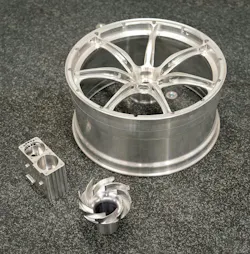 Typical components, all machined from solid aluminum, inspected by Driven Engineering on the LK CMM. Clockwise from the back: the scaled-down race car wheel, an impeller, and an aircraft fuel pump component. Typical components, all machined from solid aluminum, inspected by Driven Engineering on the LK CMM. Clockwise from the back: the scaled-down race car wheel, an impeller, and an aircraft fuel pump component.