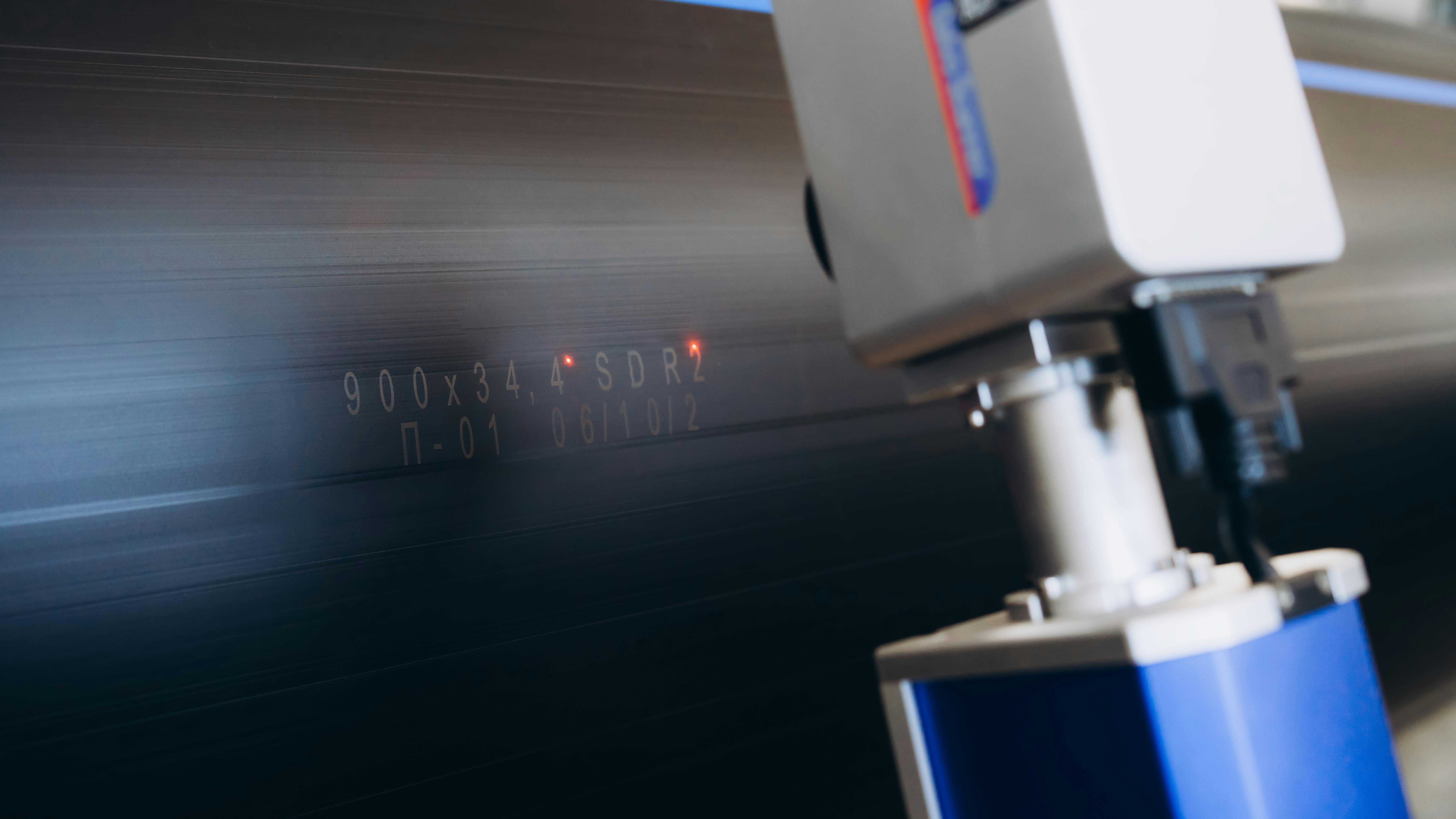 Laser Marking Machine Engraving on plastic water pipes in factory