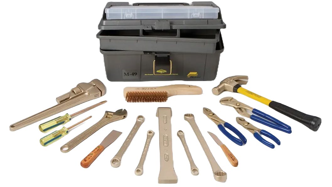 A line-up of Denios' new line of non-sparking tools laid out on a white background in a semi-circle against a toolbox