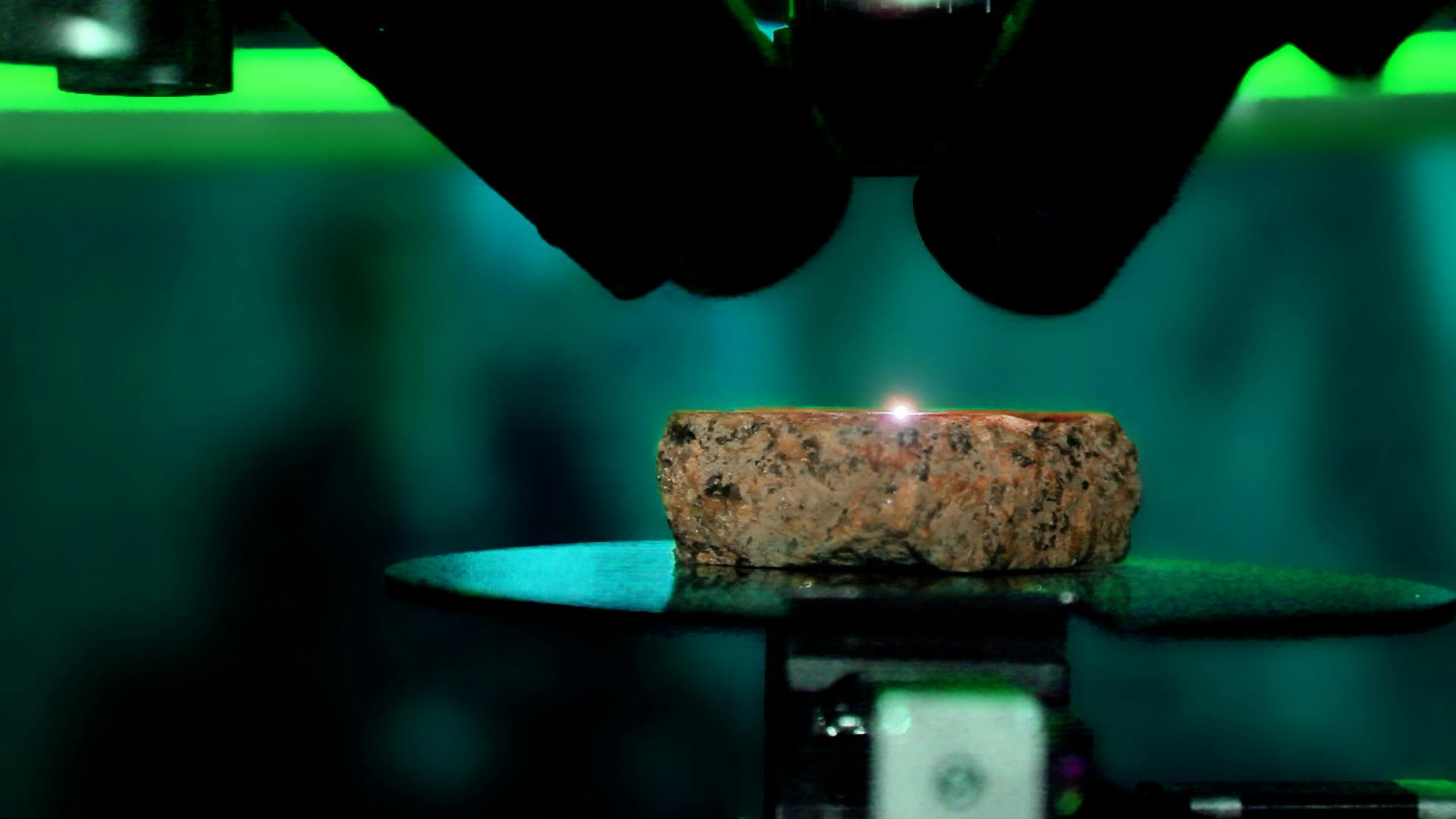 Close-up of ABLASCAN scanning the material of a rock with plasma beam.