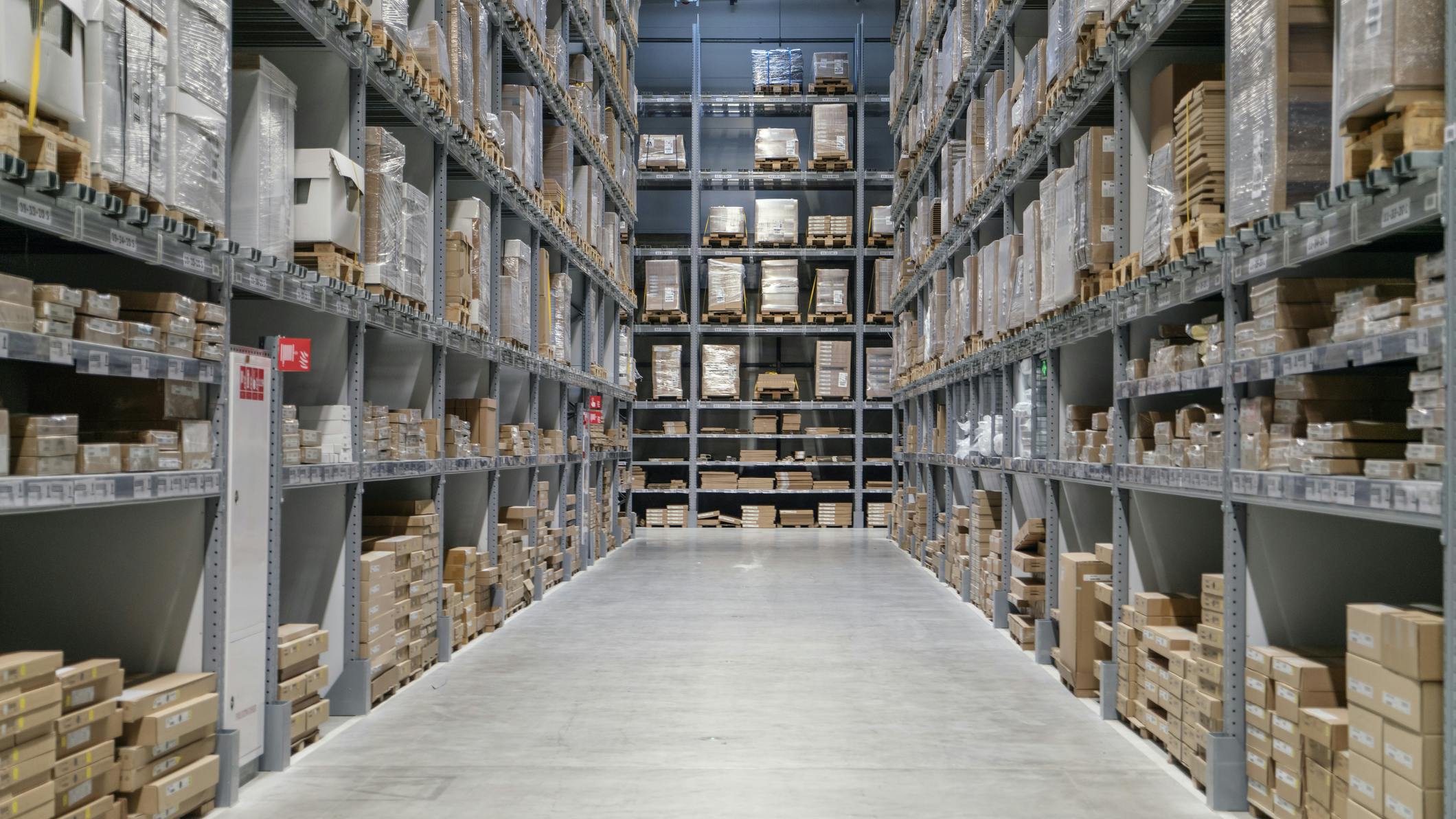 warehouse full of goods, boxes and shelves in order