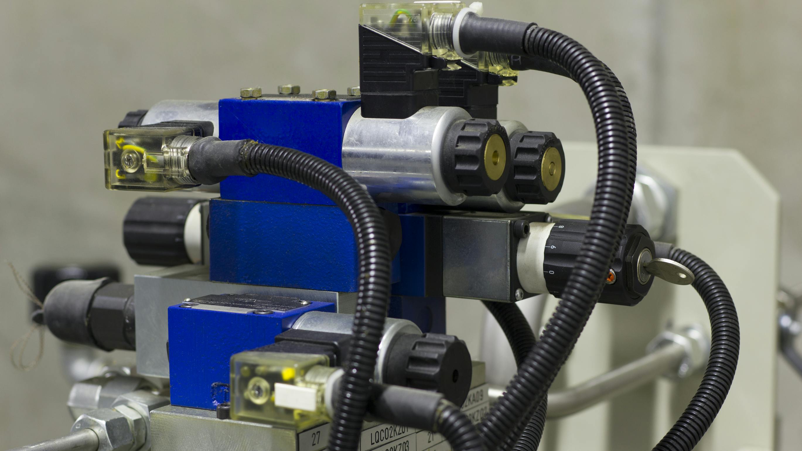 Electric solenoid valves to control hydraulics in industrial process.