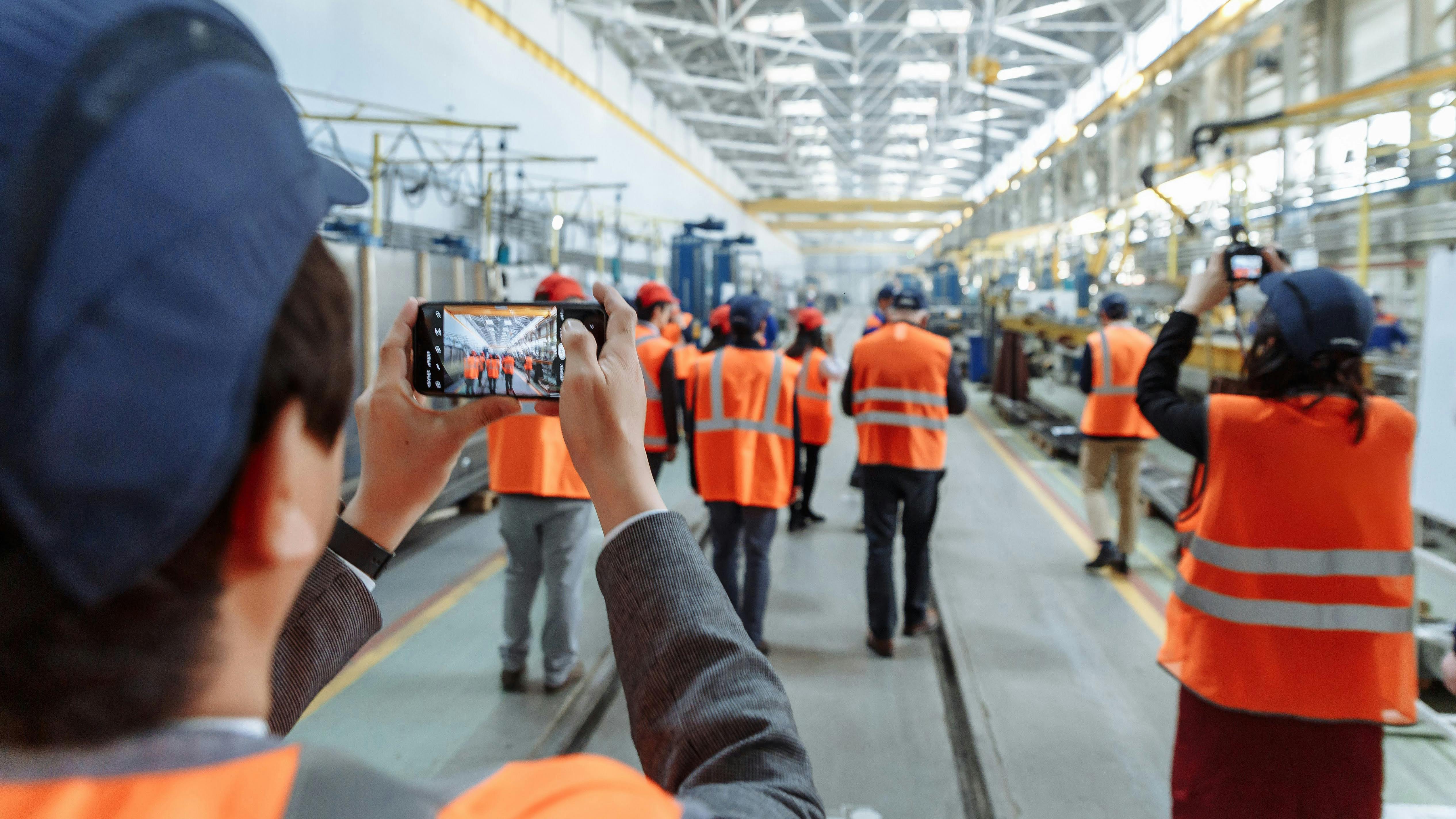 Group touring an industrial factory.