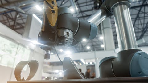 UR robot polishing a metal component