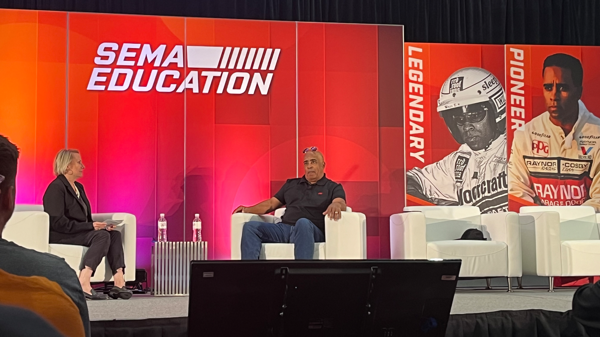 Willy T. Ribbs (right) pictured with Beth Paretta during at SEMA 2023.