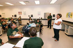 Crystal Ashby, executive VP of government and public affairs for BP America, addresses MathStar program students. Looking on is Dr. Timothy Glaude, director of Xavier's Star and SOAR programs. Crystal Ashby, executive VP of government and public affairs for BP America, addresses MathStar program students. Looking on is Dr. Timothy Glaude, director of Xavier's Star and SOAR programs.