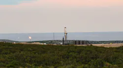 Drilling Rig and Oil Facility in the Permian Basin Texas with flare Drilling Rig and Oil Facility in the Permian Basin Texas with flare