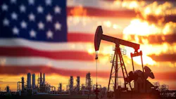 US flag behind oil and gas infrastructure US flag behind oil and gas infrastructure