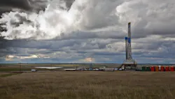 Drilling rig in North Dakota under cloudy sky Drilling rig in North Dakota under cloudy sky