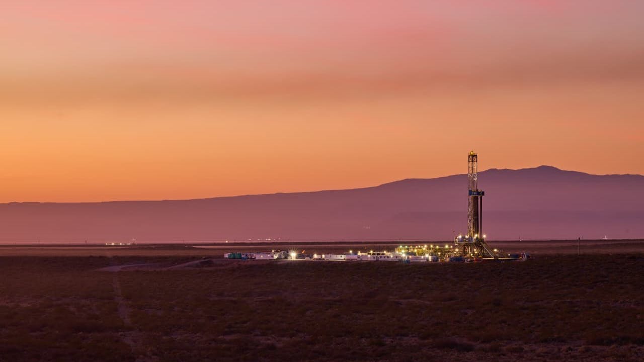 Onshore drilling rig with sunset in the background