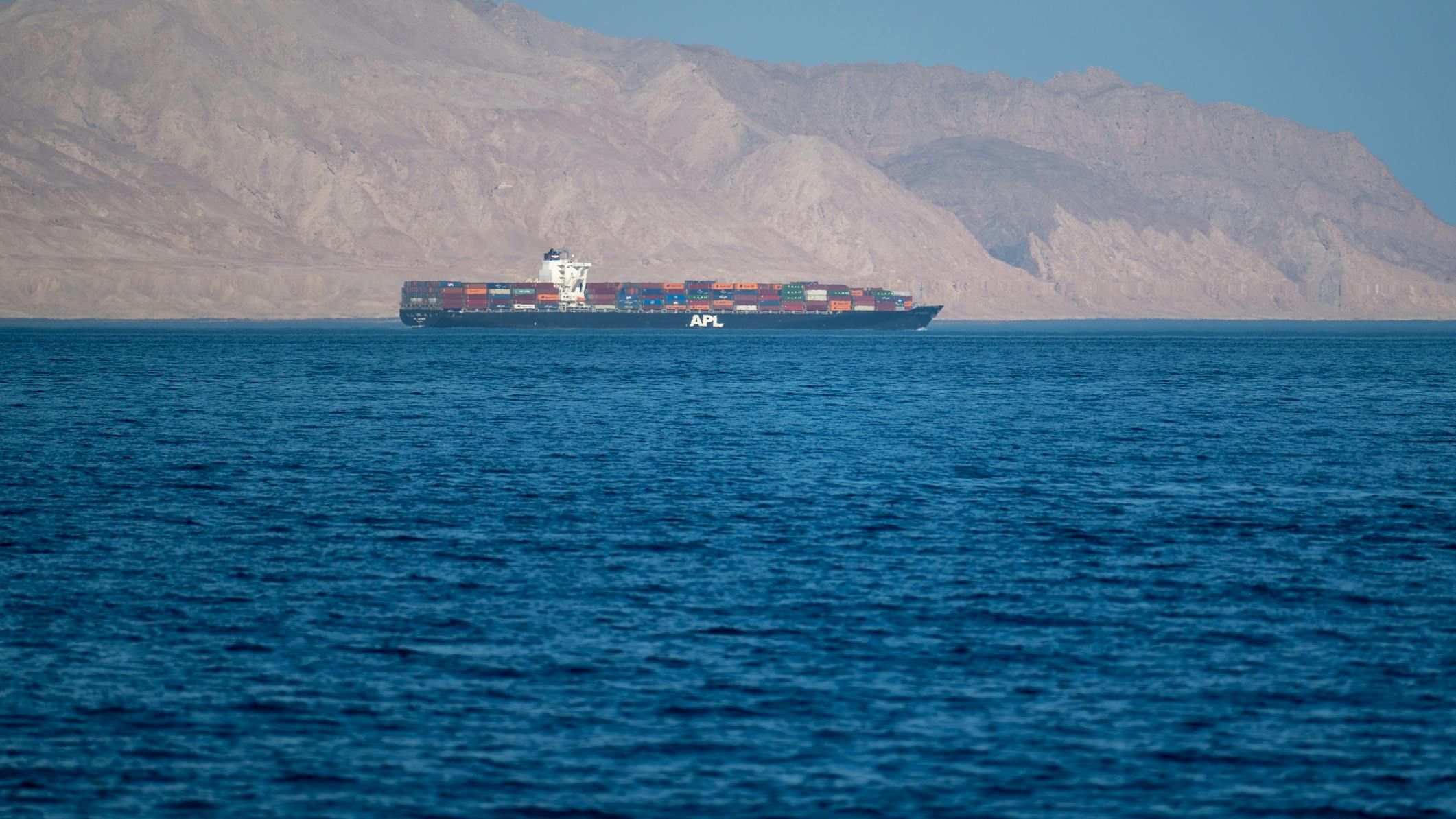 Sea container ship in the Strait of Hormuz, near Iranian coastline, 2021