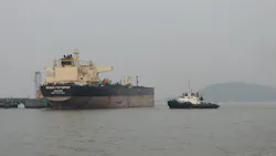 Russian oil tanker at dockyard with tugboat Russian oil tanker at dockyard with tugboat