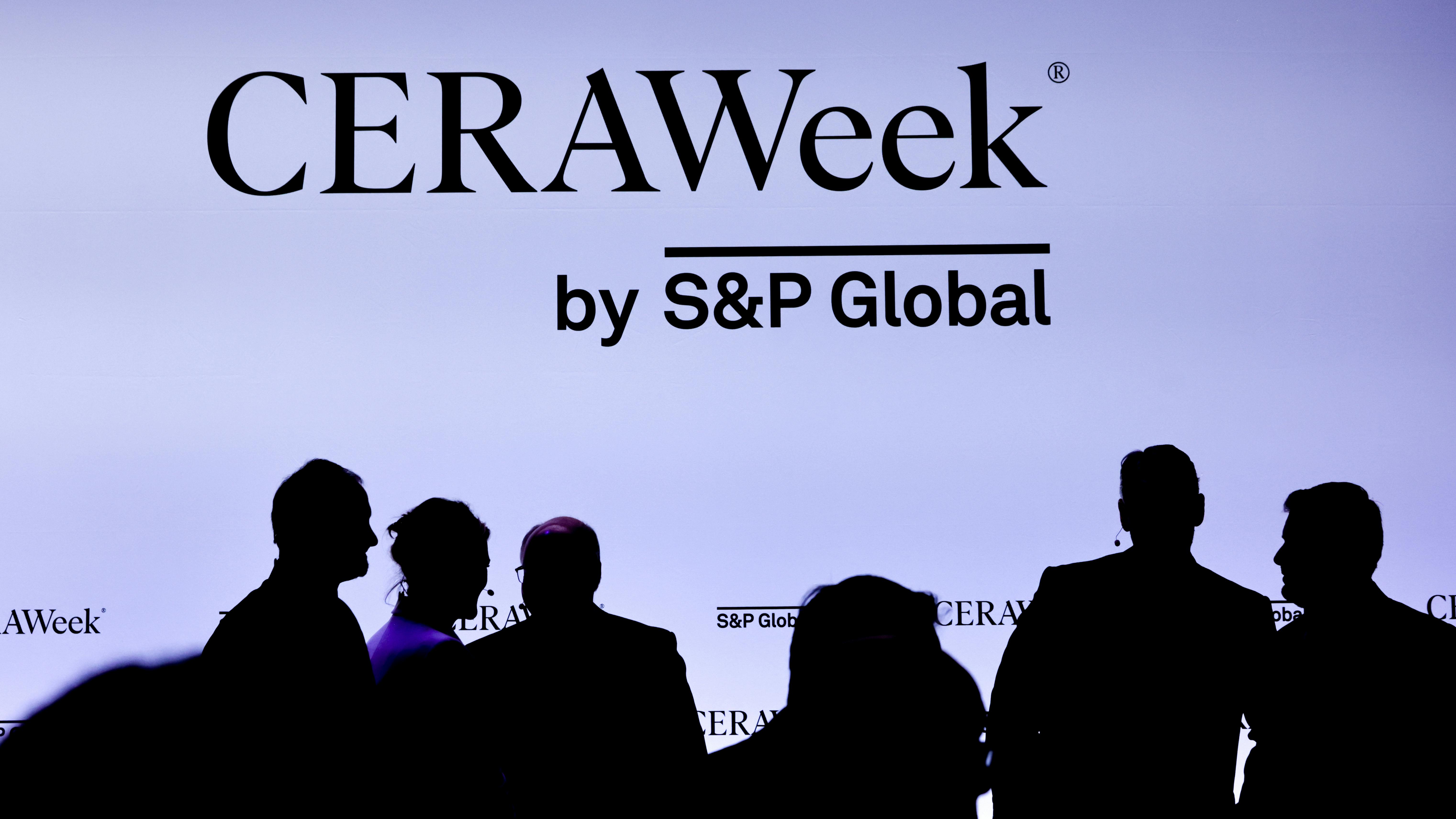 CERAWeek banner with silhouettes of conference attendees