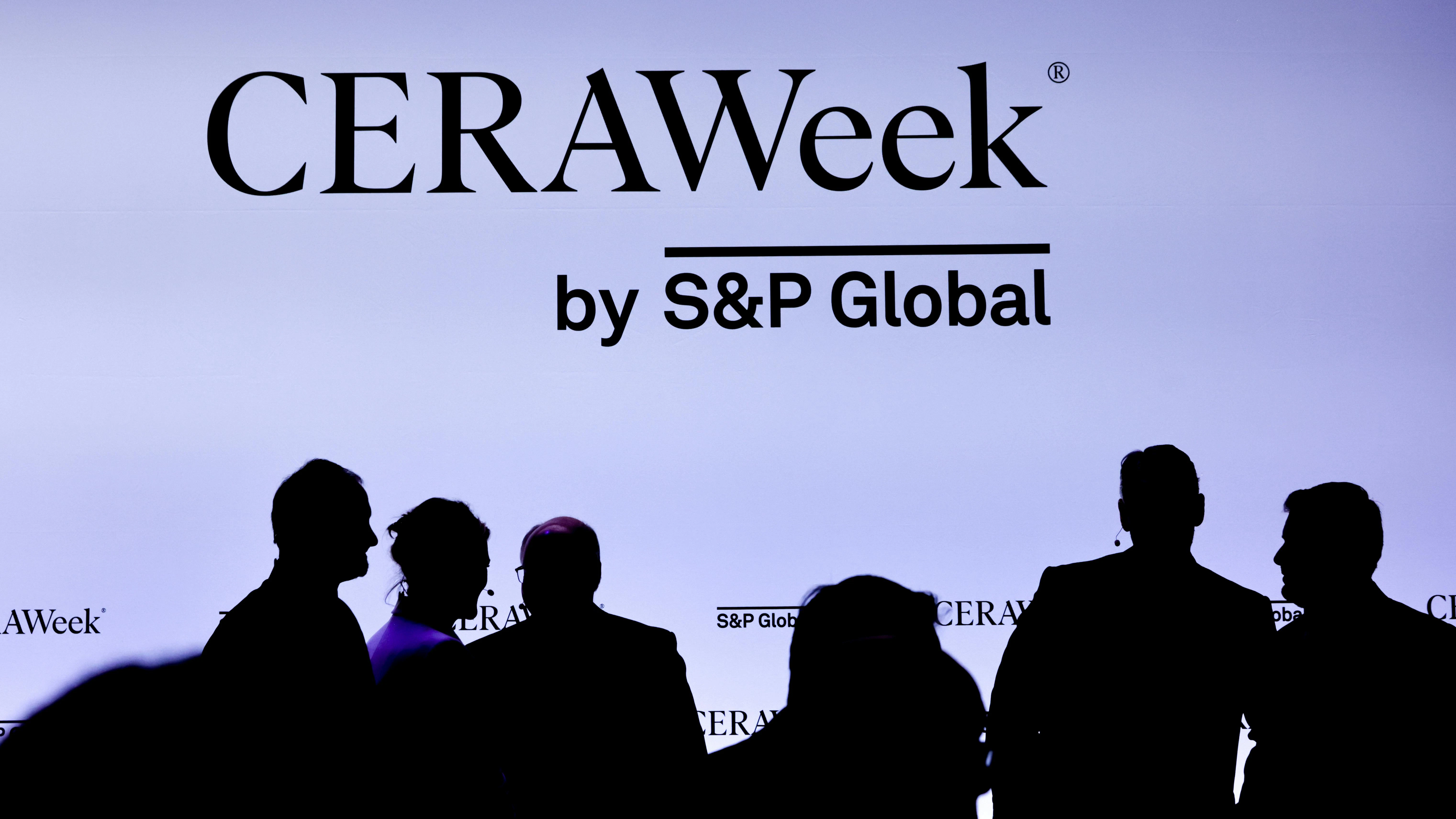 CERAWeek banner with silhouettes of conference attendees