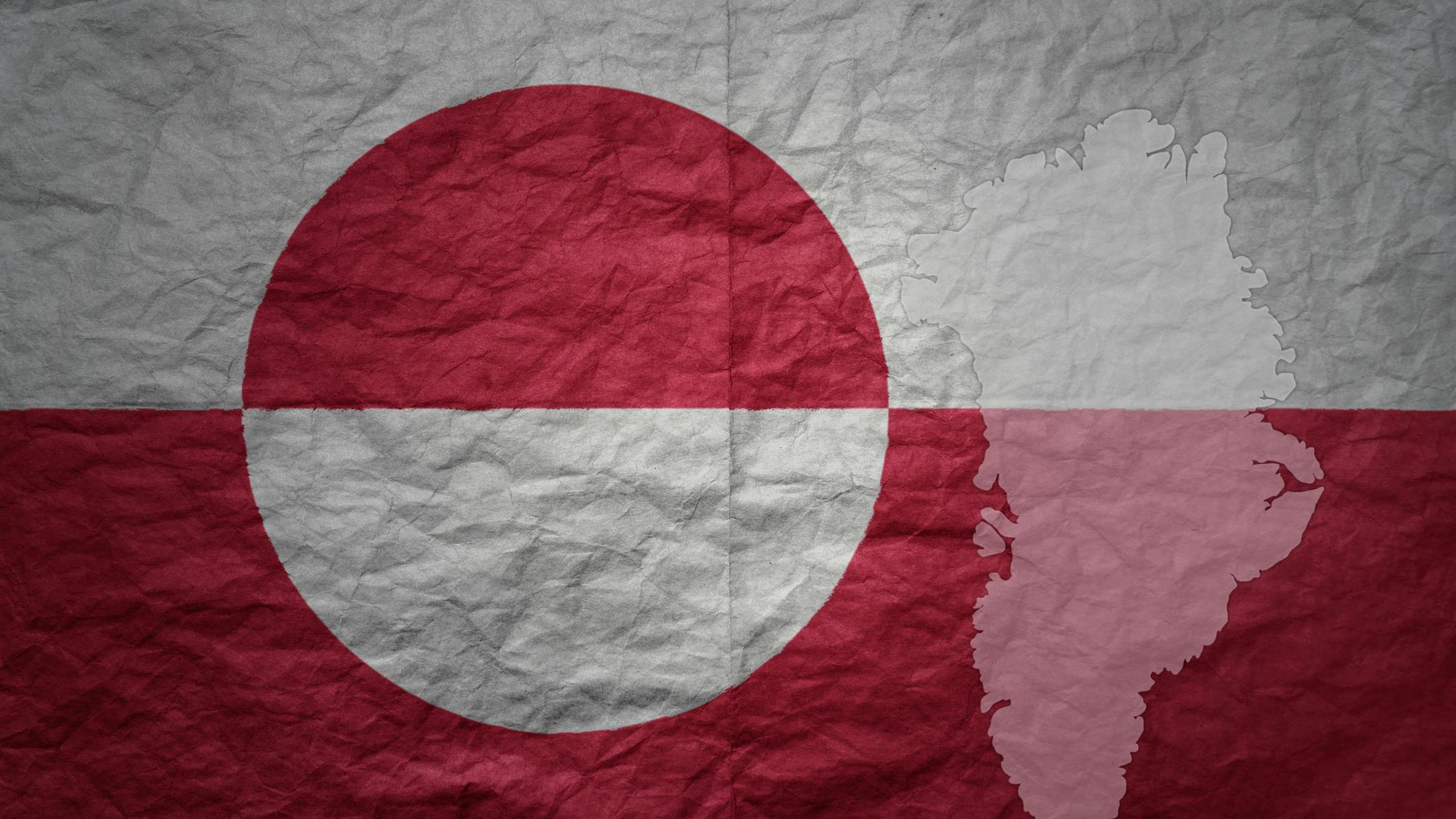 Red and white national flag and map of Greenland on paper texture background