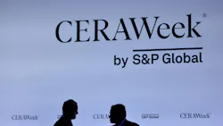 two CERAWeek attendees in silhouette in front of CERAWeek logo backdrop two CERAWeek attendees in silhouette in front of CERAWeek logo backdrop