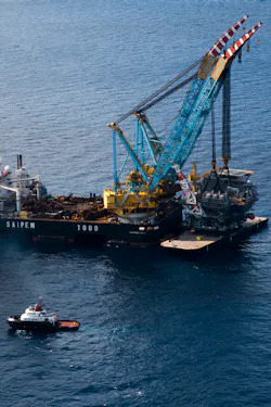 Crowley tugs deliver to Tubular Bells Crowley tugs deliver to Tubular Bells