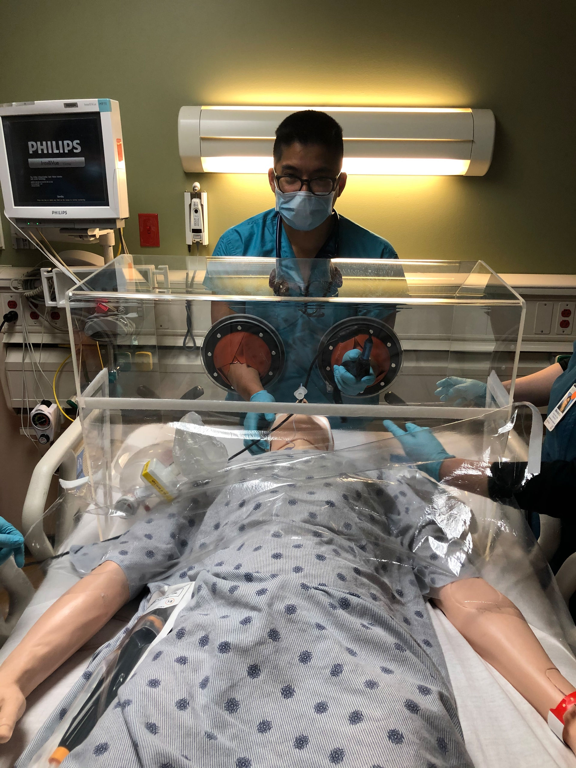 Dr. Luis Chug demonstrates how his newly introduced ViraBox protects patients and healthcare workers from exposure to the coronavirus.