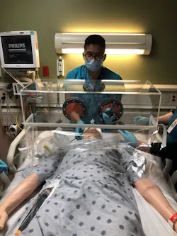 Dr. Luis Chug demonstrates how his newly introduced ViraBox protects patients and healthcare workers from exposure to the coronavirus. Dr. Luis Chug demonstrates how his newly introduced ViraBox protects patients and healthcare workers from exposure to the coronavirus.