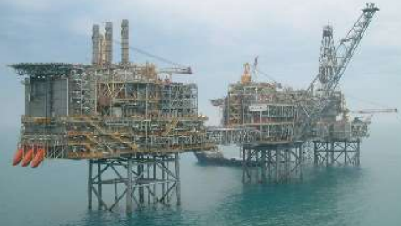 The Green Volt offshore wind project proposes to develop a floating offshore wind farm to facilitate a first-of-its-kind decarbonization of the oil and gas industry through the complete electrification of the Buzzard oil and gas field (operated by CPEL). The photo highlights the Buzzard oil and gas facility, with power generation chimneys visible on the leftmost platform.