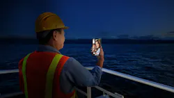An AI-generated image depicts an offshore crew member video chatting with family. An AI-generated image depicts an offshore crew member video chatting with family.