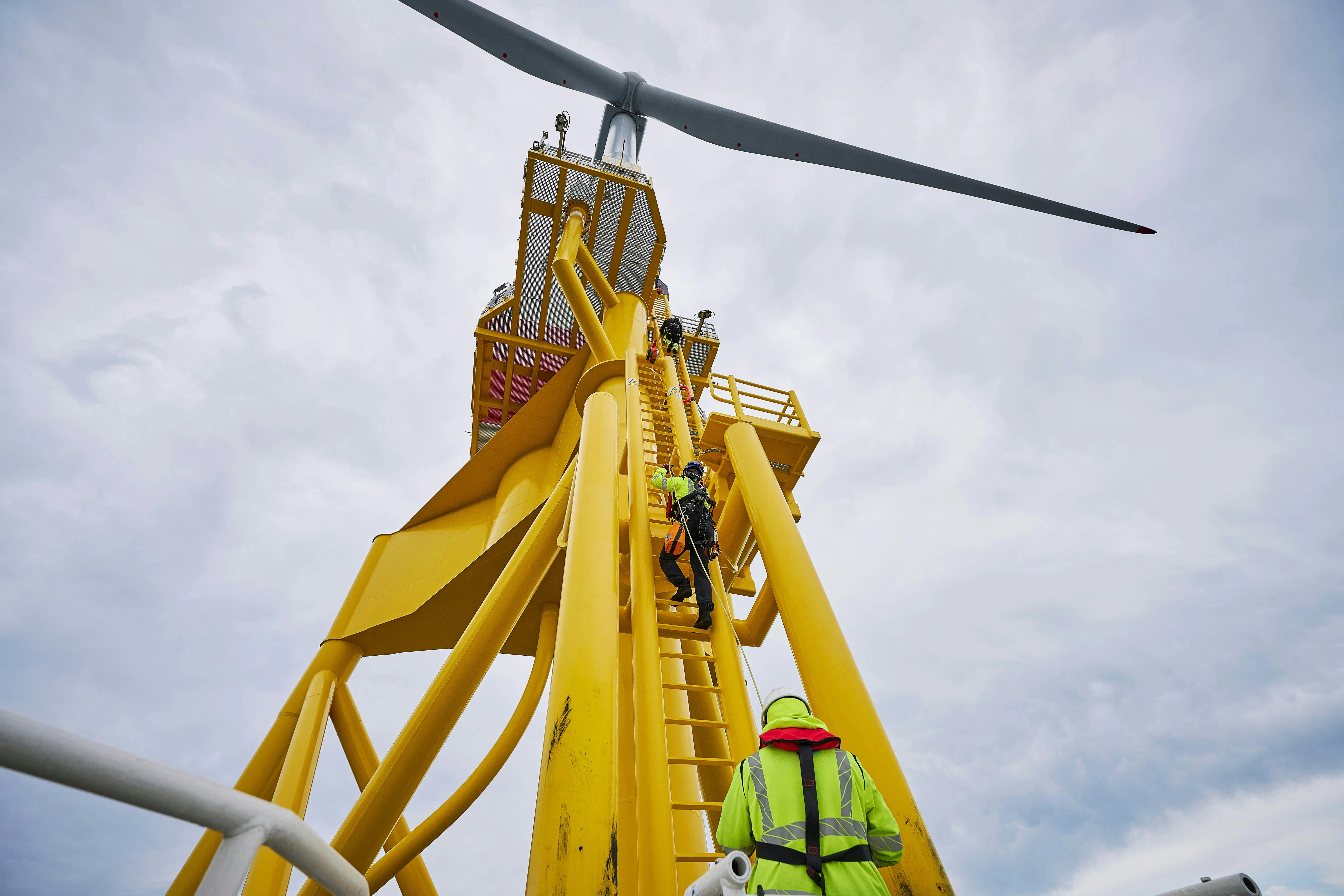 Technicians work on offshore wind equipment