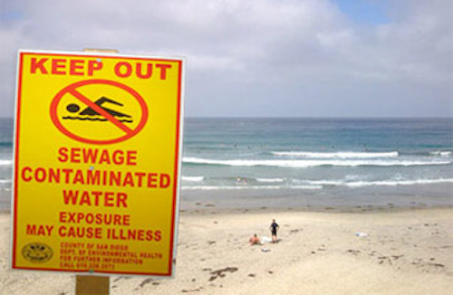 sewage sign at beach