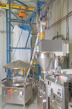 A flexible screw conveyor transports material from the bulk bag discharger to the packaging line. A flexible screw conveyor transports material from the bulk bag discharger to the packaging line.