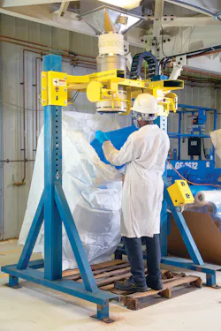 A Twin Centerpost bulk bag filler receives material through a sealed chute from the blender on the level above. The operator attaches the bag spout to the inflatable collar on the fill head. A blower inflates the bag prior to filling, eliminating creases and pre-shaping the bag for stability. A Twin Centerpost bulk bag filler receives material through a sealed chute from the blender on the level above. The operator attaches the bag spout to the inflatable collar on the fill head. A blower inflates the bag prior to filling, eliminating creases and pre-shaping the bag for stability.