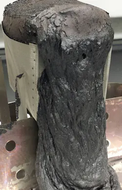 Photo 3: Screening test results demonstrated self-heating of the powder mix sample. Photo 3: Screening test results demonstrated self-heating of the powder mix sample.