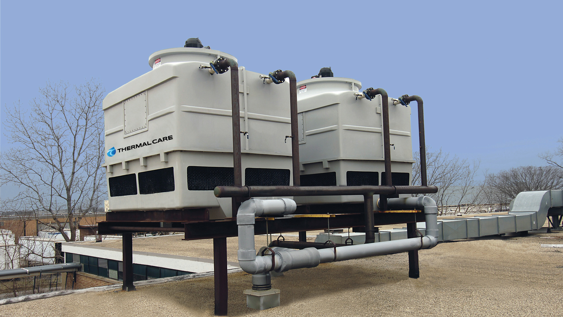 An example of two cooling towers roof mounted as part of a closed-loop system.