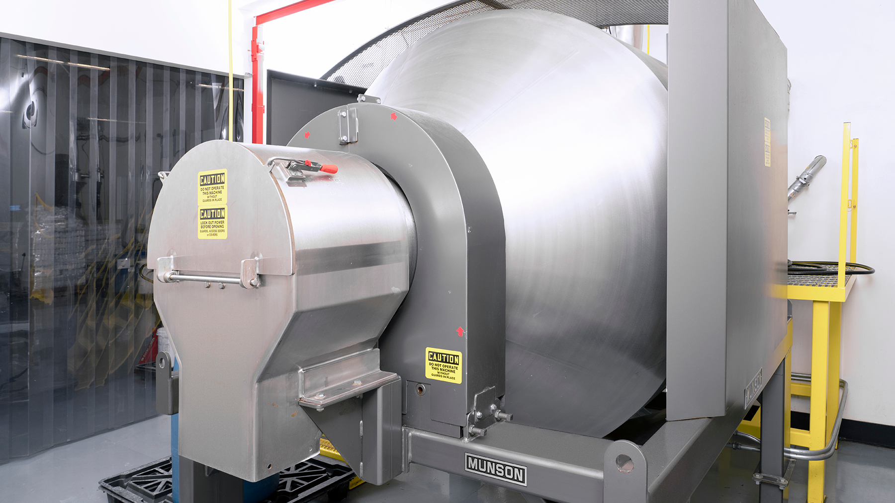 The mixer&rsquo;s inlet and outlet (shown) remain stationary while the drum rotates, allowing hard connections to upstream mechanical or pneumatic conveyors and continuous mixing as material is discharged.