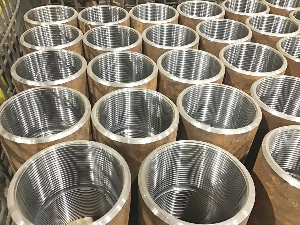 Caption: Premium couplings are machined to the tightest tolerances and may incorporate substantial design changes, often to the threads.