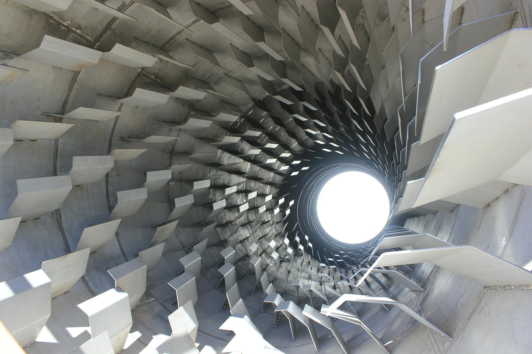 Rotary dryers contain flights, or material lifters, that pick up and drop the material through the air stream as the drum rotates, maximizing heat transfer between the material and the process gas.