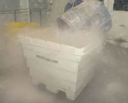 Figure 6: Manual dumping of low MIE and MEC dusts can create a major flash-fire hazard. Figure 6: Manual dumping of low MIE and MEC dusts can create a major flash-fire hazard.