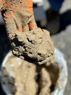 Battery materials, such as the lithium fines shown here after discharge from a centrifuge, can create production bottlenecks if handling equipment is not thoughtfully designed. Battery materials, such as the lithium fines shown here after discharge from a centrifuge, can create production bottlenecks if handling equipment is not thoughtfully designed.